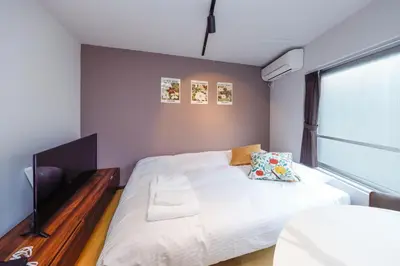 a small bedroom with a bed and a window at monthly TS Yoyogi in Tokyo