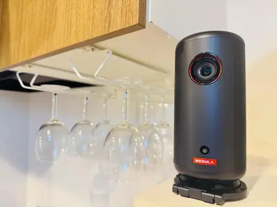 a digital camera on a stand next to wine glasses at KAKURE Yahiro 3-Chome New 2LDK House,Washer-Dryer & Free Parking,1 Stop to Skytree in Tokyo