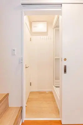a hallway with a door leading to a closet at KAKURE Yahiro 3-Chome New 2LDK House,Washer-Dryer & Free Parking,1 Stop to Skytree in Tokyo