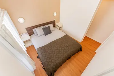 a small bedroom with a bed in a room at KAKURE Yahiro 3-Chome New 2LDK House,Washer-Dryer & Free Parking,1 Stop to Skytree in Tokyo