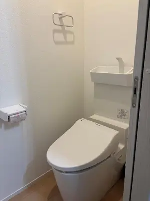 a small bathroom with a toilet and a sink at Pad Foot in Tokyo