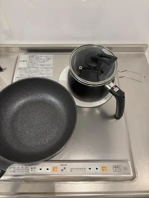 a frying pan sitting on top of a stove at Pad Foot in Tokyo
