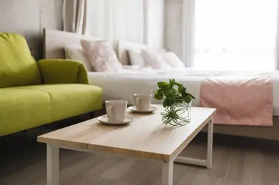 a living room with a coffee table and a couch at Apro Stay \u54c1\u5ddd\u685c\u30d2\u30eb\u30ba11 in Tokyo