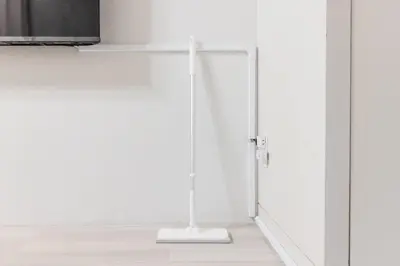 a white stand in the corner of a room at Apro Stay \u54c1\u5ddd\u685c\u30d2\u30eb\u30ba11 in Tokyo