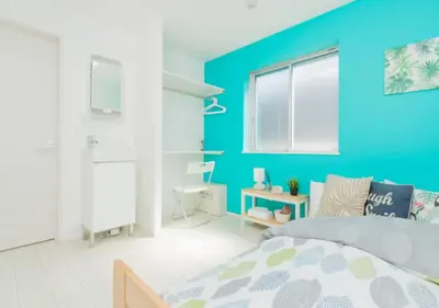 a blue bedroom with a bed and a desk at Tokyo Kiyosumi-Shirakawa Family House, 6BR, 2Bath, Sleeps 8 in Tokyo