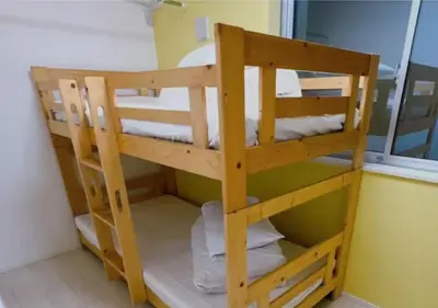 a wooden bunk bed in a room with a window at Tokyo Kiyosumi-Shirakawa Family House, 6BR, 2Bath, Sleeps 8 in Tokyo