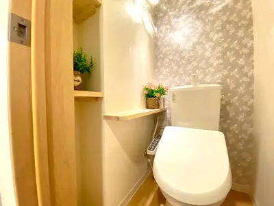 a bathroom with a white toilet in a room at H-Tokyo Simple and Warm Rooms in Tokyo