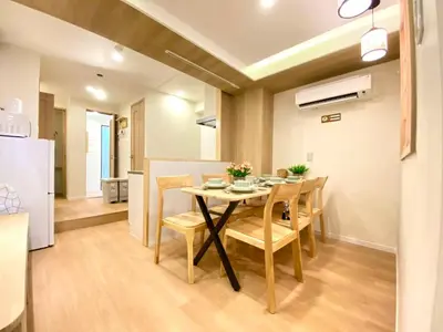 a kitchen and dining room with a table and chairs at H-Tokyo Simple and Warm Rooms in Tokyo
