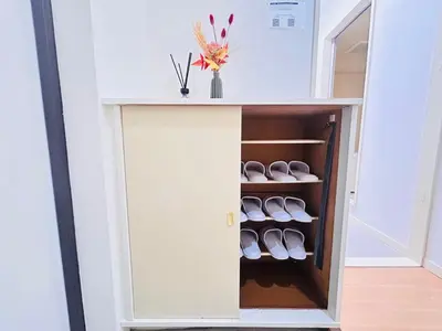 a cabinet with shoes inside of a room at XW-Ikebukuro \u4e2d\u5ddd 306-TS0040 in Tokyo