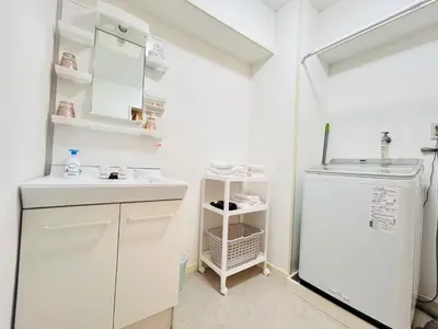 a kitchen with a white refrigerator and a sink at XW-Ikebukuro \u4e2d\u5ddd 306-TS0040 in Tokyo