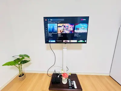a computer monitor sitting on a stand in a room at XW-Ikebukuro \u4e2d\u5ddd 306-TS0040 in Tokyo