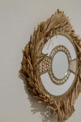 a wreath with a round mirror on a wall at Tokyo Skytree 102 Bali-Style Double bed Bath & WC in Tokyo