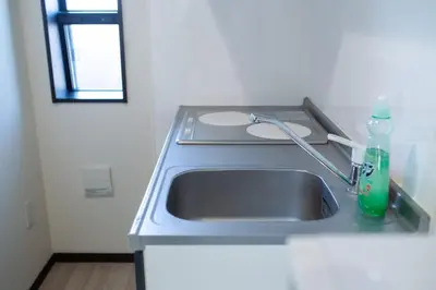 a kitchen counter with a sink and a window at Tokyo Skytree 201 Elegance Blue Twin Room with Bath and WC in Tokyo
