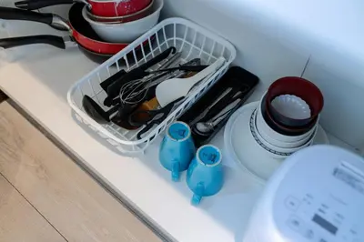 a drawer filled with utensils on top of a counter at Tokyo Skytree 201 Elegance Blue Twin Room with Bath and WC in Tokyo