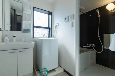 a white bathroom with a sink and a shower at Tokyo Skytree 301 Elegance Blue Twin Room bath WC in Tokyo