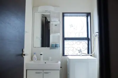 a white bathroom with a sink and a mirror at Tokyo Skytree 301 Elegance Blue Twin Room bath WC in Tokyo