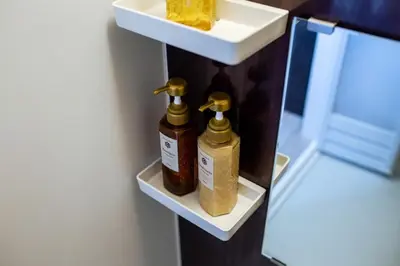 two bottles of essential oils on a shelf in a refrigerator at Tokyo Skytree 202 Bali-style Double Room Bathtub Private Bathroom 2 minutes to subway in Tokyo