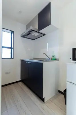 a kitchen with white walls and a black and white sink at Tokyo Skytree 202 Bali-style Double Room Bathtub Private Bathroom 2 minutes to subway in Tokyo