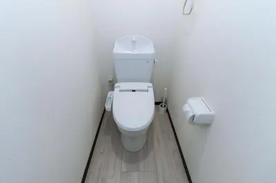 a bathroom with a white toilet in a stall at Tokyo Skytree 302 Bali-Style Double Bath & WC in Tokyo