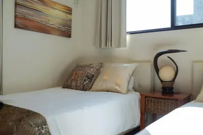 a bedroom with a bed and a lamp on a table at Tokyo Skytree 401 Bali-Style Twin bed Bath & WC in Tokyo