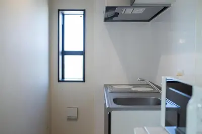 a kitchen with a stove and a window at Tokyo Skytree 401 Bali-Style Twin bed Bath & WC in Tokyo