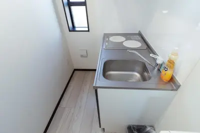 a small kitchen with a sink in a small room at Tokyo Skytree 401 Bali-Style Twin bed Bath & WC in Tokyo