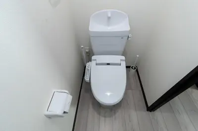 a bathroom with a white toilet and a trash can at Tokyo Skytree 402 Bali-Style Double bed Bath & WC in Tokyo