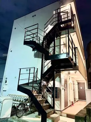 a spiral staircase on the side of a building at Naomi\u4e2d\u91ce\u5742\u4e0a\u65b0\u5bbf-NN0126 in Tokyo