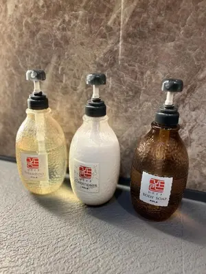 a trio of three bottles with chinese writing on them at \u30de\u30a4\u30b0\u30ec\u5357\u9752\u5c71 in Tokyo
