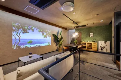 a living room with a large painting on the wall at \u30de\u30a4\u30b0\u30ec\u5357\u9752\u5c71 in Tokyo