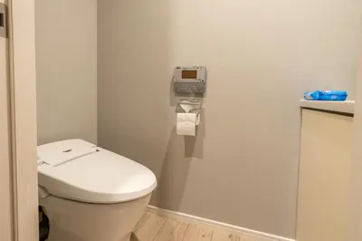 a bathroom with a toilet in a room at \u76ee\u767d Yoko hotel shinnjuku, shinokubo 10 people stay, big room in Tokyo