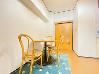 a dining room with two chairs and a table at The Hope Ikebukuro in Tokyo
