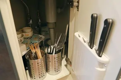 a cupboard with utensils in it at \u30ac\u30a4\u30a2\u6b4c\u821e\u4f0e\u753a203 in Tokyo
