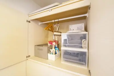 a small refrigerator with its door open in a kitchen at \u30b5\u30f3\u30cf\u30a4\u30c4\u521d\u53f0401 in Tokyo