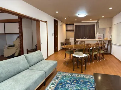 a living room with a couch and a table at Kenichi Retreat in Tokyo