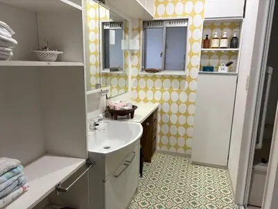a bathroom with a sink and a mirror at Kenichi Retreat in Tokyo