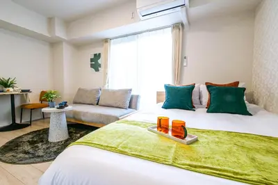 a hotel room with a bed and a couch at Mr Kintaro Hotel Kinshicho in Tokyo