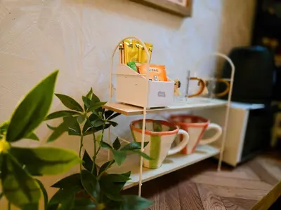 a shelf with cups and a box on it at UENO 504 jellynehouse in Tokyo