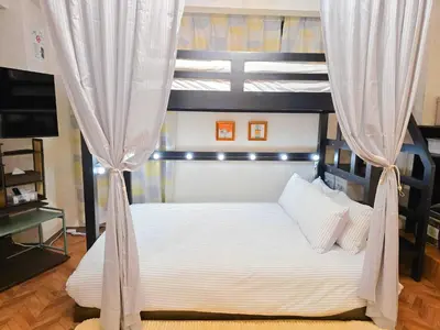 a bedroom with a white bed with a canopy at UENO 504 jellynehouse in Tokyo