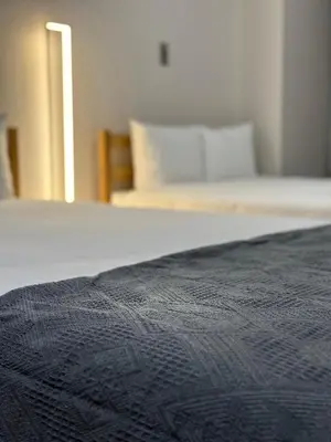a close up of a bed in a bedroom at \u65b0\u5bbf\u533a\u65b0\u5927\u4e45\u4fdd\u304b\u3089\u5f92\u6b6910\u5206\u6b4c\u821e\u4f0e\u753a in Tokyo