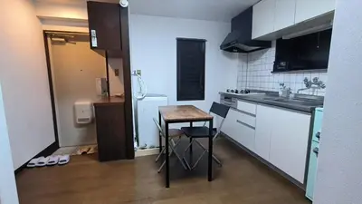 a small kitchen with a small table and a sink at Shinjuku 2bed rooms sunny apart ment#2室1厅阳光公寓#高速无限制网路2&2 in Tokyo