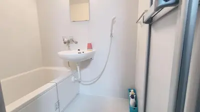 a white bathroom with a sink and a bath tub at Shinjuku 2bed rooms sunny apart ment#2室1厅阳光公寓#高速无限制网路2&2 in Tokyo