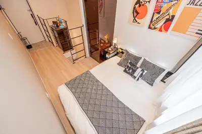 an overhead view of a bedroom with a bed and pillows at Mi-HOTEL SHIMOKITAZAWA in Tokyo