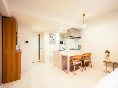 a kitchen and dining room with a table and chairs at Section L Residence Moto-Azabu in Tokyo