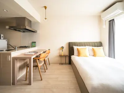 a small apartment with a bed and a kitchen at Section L Residence Moto-Azabu in Tokyo
