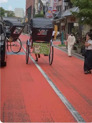 a horse drawn carriage on a city street at OZ sumida in Tokyo
