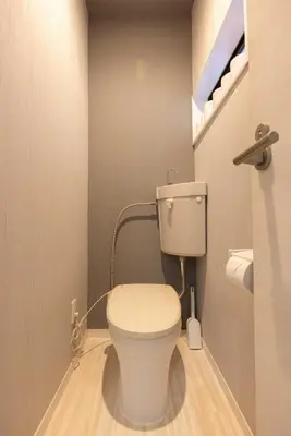 a bathroom with a white toilet in a room at OZ sumida in Tokyo
