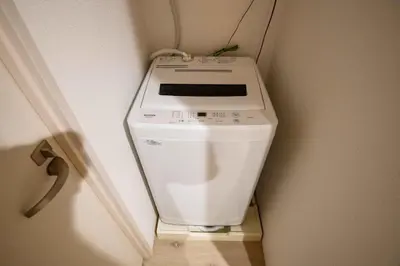 a toilet in the corner of a room at Urban Nest Otsuka 301 JR OTSUKA STATION in Tokyo