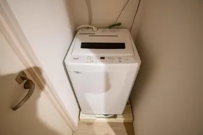 a toilet in the corner of a room at Urban Nest Otsuka 301 JR OTSUKA STATION in Tokyo