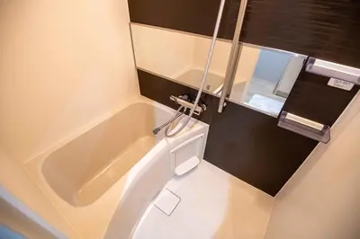 a small bathroom with a tub and a sink at Pure Rest Otsuka 302 JR Otsuka Station in Tokyo